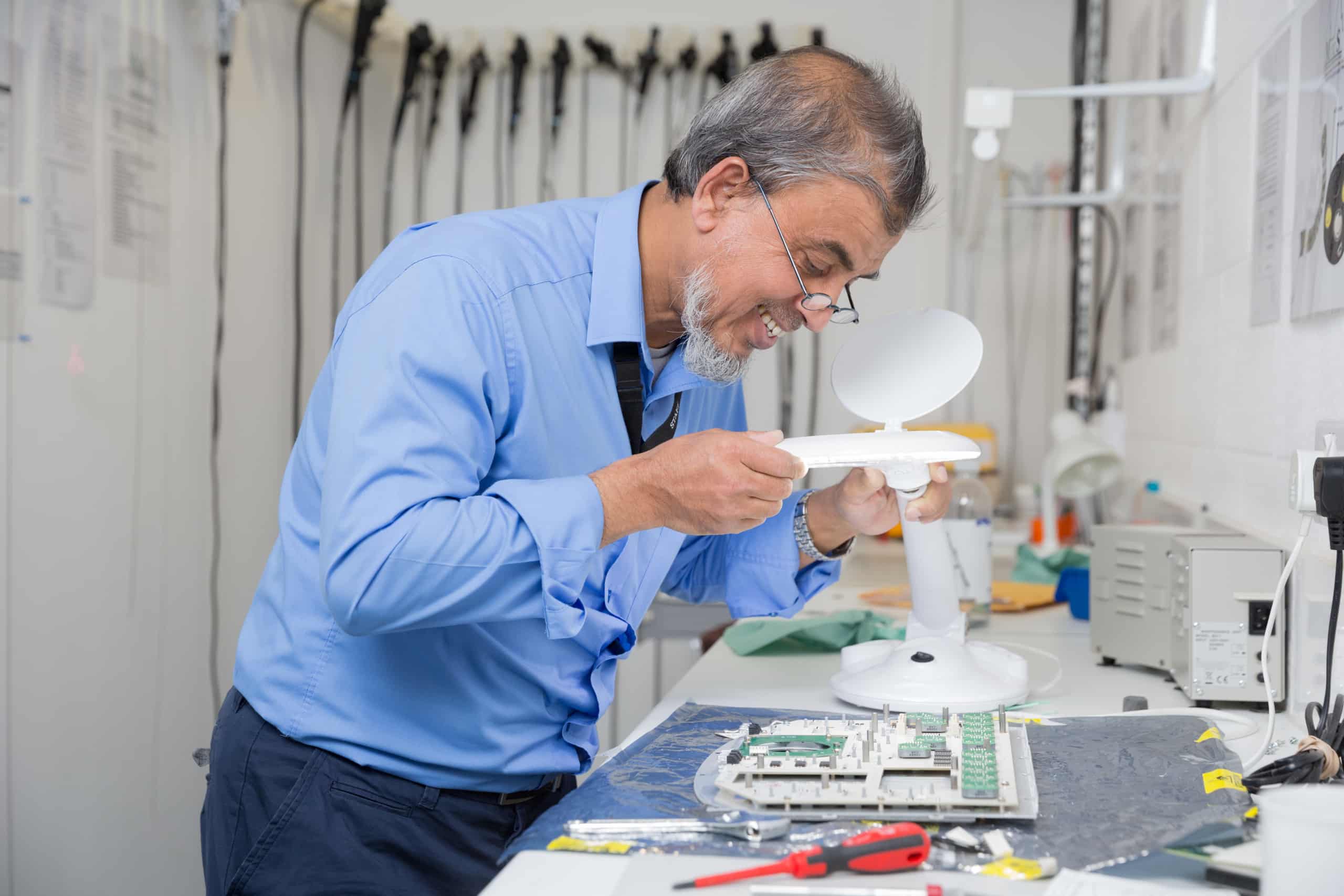 engineer repairing a part for a machine